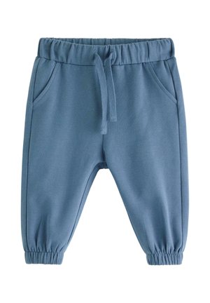 Blå sweatpants med elastisk midja, dragsko och sidofickor. Taperade mudd vid ankeln och slät textur.