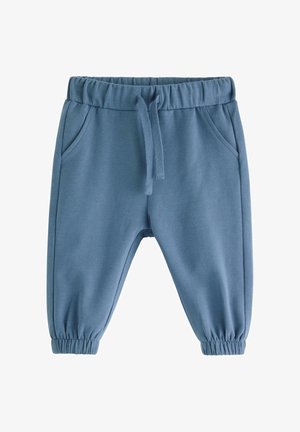Blå sweatpants med elastisk midja, dragsko och sidofickor. Taperade mudd vid ankeln och slät textur.