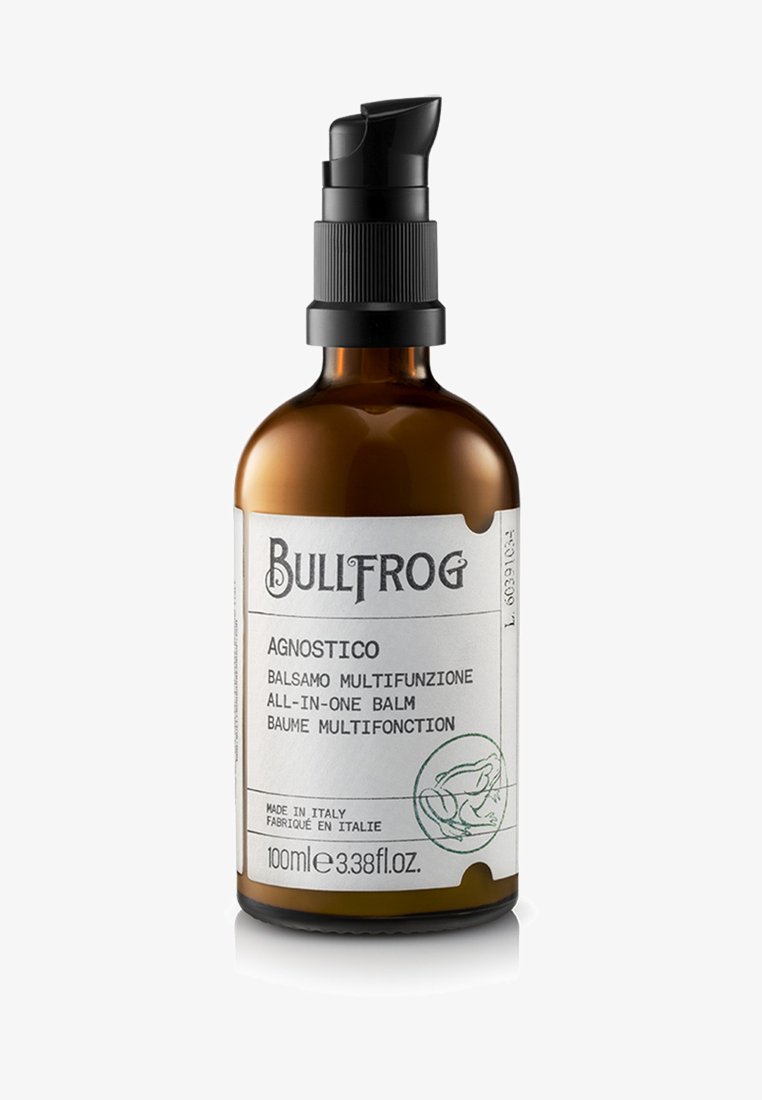 Bottiglia in vetro ambra con pompa, etichettata "Bullfrog Agnostico." Contiene 100 ml di balsamo tutto-in-uno. Design minimalista con testo bianco e verde.