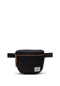 Borsa da toiletta in tessuto nero con cerniera dorata, fascetta in pelle e manico laterale. Presenta una patch con logo bianco sulla parte anteriore. Forma rotonda, design minimal.