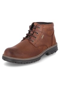 Bottes en cuir marron à la cheville avec bout rond, con�çu avec un laçage, semelle en caoutchouc texturée et détails de couture renforcés. Membrane imperméable incluse.