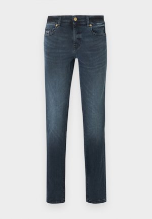 Dark blue slim-fit jeans with front button, zipper, five pockets, and slight faded effect on thighs and knees.