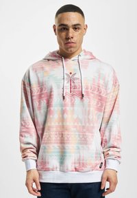 Hooded sweatshirt featuring a pastel geometric pattern in pink, mint, and white. Includes a kangaroo pocket and drawstring hood.