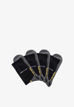 Black and gray socks with a ribbed top, yellow accents, and 'JOHN DEWIN' text. Contains four pairs, made from a soft, stretchy fabric.