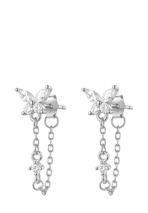 Silver butterfly earrings with a chain accent, featuring small clear gemstones, worn on a model's ear with a simple ring on her finger.
