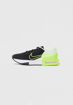 Black and neon green Nike Air Max running shoe with mesh upper, visible air cushion in sole, and white midsole, shown from the side.