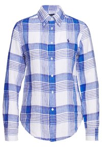 Camicia a maniche lunghe in tessuto a quadri blu e bianchi, con colletto e orlo arrotondato. Realizzata in un tessuto leggero con una finitura testurizzata.