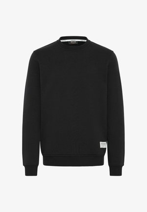 Mustarmust väljakraanikaelusega sviiter, ribitud varrukate ja servi servadega, valmistatud pehmest kangast, millel on väike valge kaubamärgi silt vasakul all.}}