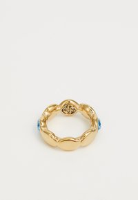Gold ring with a smooth, rounded design, featuring two blue gemstones on opposing sides and an engraved detail on the inner band.