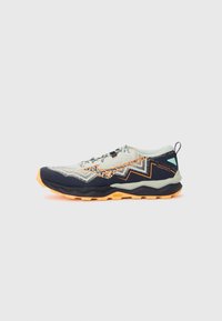 Trail running shoe featuring a light grey upper with dark blue and orange accents, textured patterns, and a grippy Vibram sole for traction.