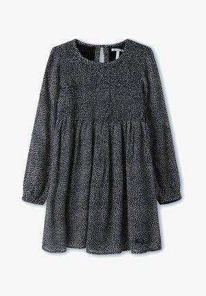 Robe noire et blanche avec des manches longues, taille froncée, encolure ronde et dos en forme de trou de serrure. Présente un motif émaillé et un tissu doux.