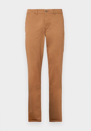Ruske puuvillaiset chinot slim-fit muotoilulla, jossa on nappikiinnitys, sivutaskut ja sileä pinta.