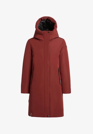 Ruskohalseinen parka suurella, eristyksellä varustetulla hupulla, jossa on kaksi vetoketjullista taskua ja sileä rakenne. Sisävuori on musta.