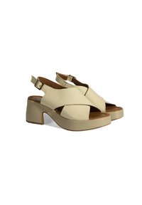 Beige leather slingback shoes with an open toe, featuring cross-straps, a chunky heel, and a textured sole. Buckle detail on the ankle strap.