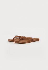 Brown flip-flops with a textured footbed, thin straps, and a subtle striped accent on the upper. Rubber sole with a slight heel.