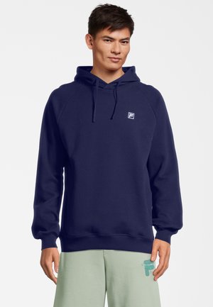 Felpa blu navy in cotone morbido, con cappuccio e polsini a costine. Piccolo logo bianco sul petto. Design caldo e dalla vestibilità rilassata.