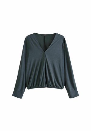 Blouse gris foncé à manches longues, col en V, taille élastique froncée et larges poignets, présentée sur un fond blanc.