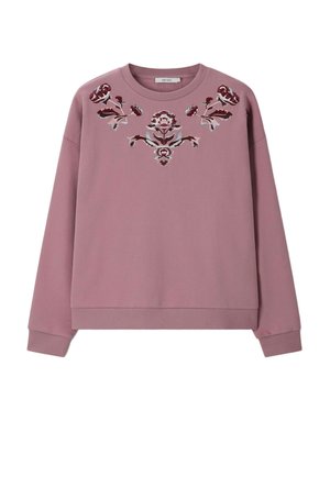 Sweat-shirt mauve à col rond avec poignets et ourlet côtelés, orné d'une broderie florale symétrique de couleur rouge foncé et blanche sur la poitrine.