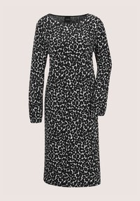 Langärmliges Kleid mit Leopardenmuster in Schwarz und Weiß, runder Ausschnitt und figurnaher Silhouette.