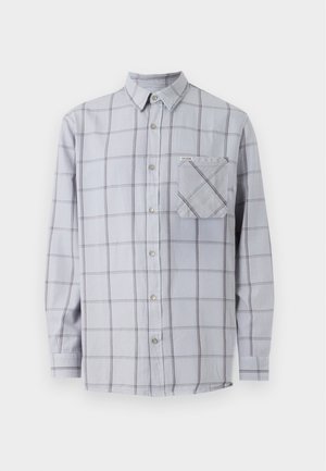 Camicia a maniche lunghe di un grigio chiaro con motivo a quadri, dotata di taschino sul petto e colletto. Realizzata in tessuto intrecciato con una texture morbida.