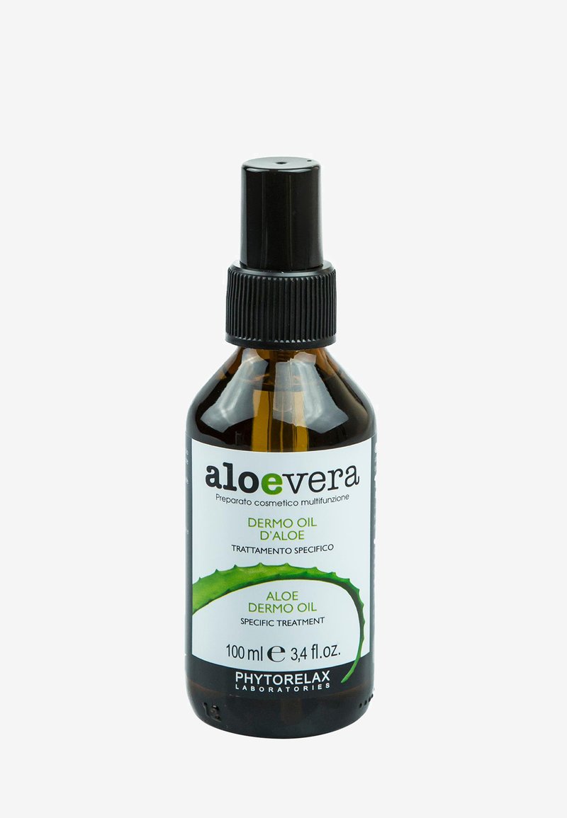 Aloe vera dermoolja i en 100 ml brun glasflaska med en svart spraydys. Etiketten har gröna accenter och tvåspråkig text.