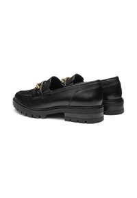 Black leather loafers featuring a textured upper, gold hardware accent, and a chunky, ridged rubber sole for traction.