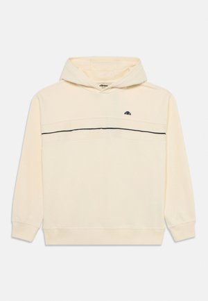 Kreemivärvi dressipluus väikese musta logoga rinnal ja õhukese musta horisontaalse triibuga ees.