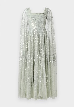 Robe longue en vert pastel avec décolleté carré, longues manches transparentes et une coupe cintrée qui s'évasent, ornée de sequins argentés.