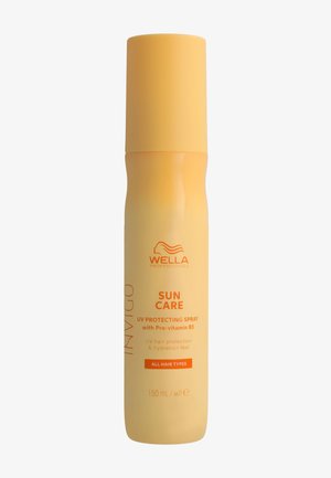 Bouteille de spray protecteur solaire Wella Professionals avec Pro-vitamine B5, pour tous types de cheveux, 150 ml, emballage jaune-orange.