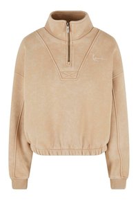 Beige színű pulóver, fél cipzárral, bordázott mandzsettákkal és elasztikus alsó résszel. Jellemzője az azonos színű varrás és egy kis fehér logo.