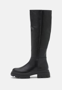 Tall black leather boots with a sleek design, rounded toe, chunky black rubber sole, and minimal stitching details along the sides.