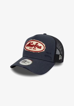 Navy blue baseball cap made of fabric with a mesh back, featuring a distressed logo patch with red and cream accents. Adjustable size.