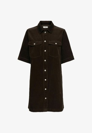 Tummanruskea corduroykangainen paitamekko, jossa on lyhyet hihat, kauluksellinen pääntie, kaksi rintataskua ja edessä hopeiset napit sulkemista varten.