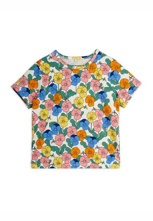 Kortærmet skjorte med overalt blomsterprint af stemorsblomster i pink, blå, orange og gul på en lys baggrund.