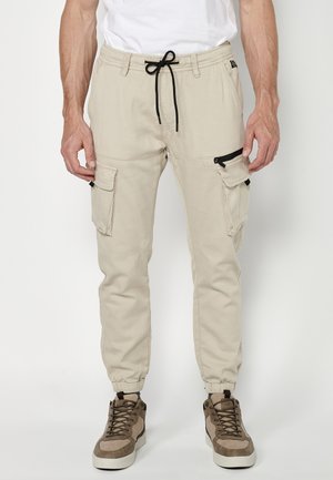JOGGER  - Donji dijelovi trenirke - beige