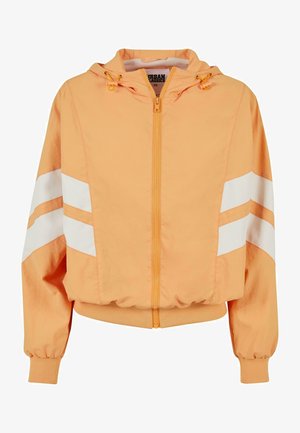 Oranžna zadrževalna jakna s kapuco, z belimi črtami na rokavih, rebrastimi manšetami in strukturirano notranjo oblogo.