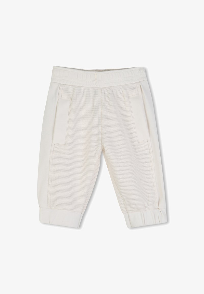 Pantalon blanc en coton texturé avec un motif côtelé, doté de poches latérales et d'ourlets de chevilles élastiques resserrés.