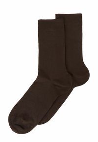 Calcetines de algodón marrón con una textura suave, que presentan un puño acanalado y un diseño de punta redondeada. Adecuados para uso casual.