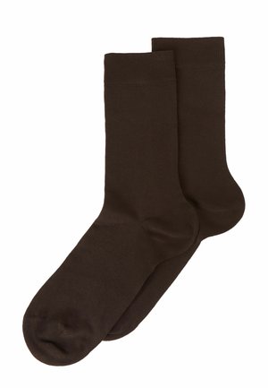 Braune Baumwollsocken mit einer glatten Textur, ausgestattet mit einem gerippten Bund und einem runden Zehendesign. Geeignet für die Freizeit.