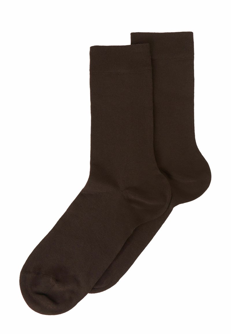 Calcetines de algodón marrón con una textura suave, que presentan un puño acanalado y un diseño de punta redondeada. Adecuados para uso casual.
