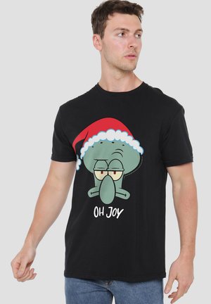 Schwarzes Baumwoll-T-Shirt mit einem Cartoon-Charakter und einem Weihnachtsmannhut sowie dem Text "OH JOY" darunter. Kurze Ärmel und entspannte Passform.