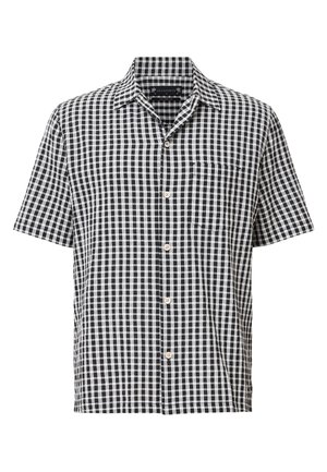 Camicia a maniche corte a scacchi bianca e nera, con colletto, bottoni frontali e taschino sul petto. Tessuto leggero con motivo a griglia.