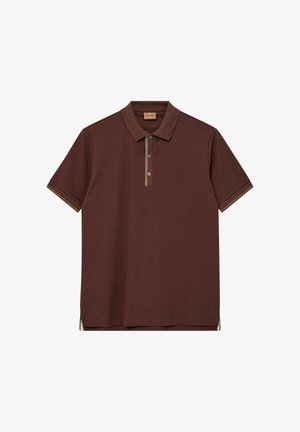 Brašna polo majica iz bombaža s ovratnikom, tremi gumbi in kontrastnim obrobjem v svetlo rjavi in modri barvi ob srednjem šivu in rokavih.