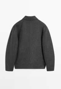 Dark gray woolen jacket with a collared neck, relaxed fit, and raglan sleeves. Plain texture, no visible patterns or hardware.
