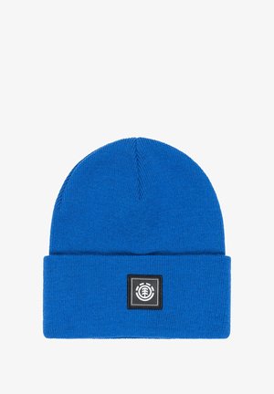 Blue knit beanie made of soft fabric with a folded cuff. Features a square logo patch in black and white on the front.