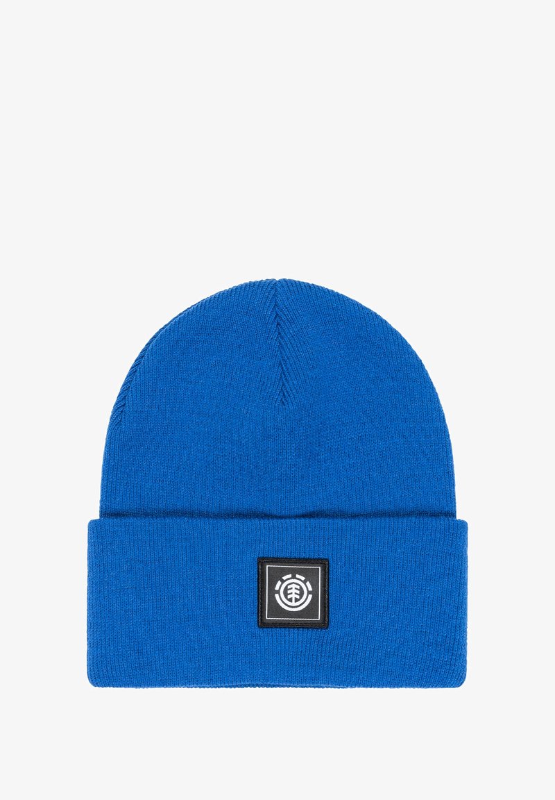 Blue knit beanie made of soft fabric with a folded cuff. Features a square logo patch in black and white on the front.