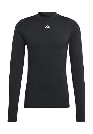 Zwarte lange mouwen sportshirt, gemaakt van gladde, rekbare stof. Heeft een ronde halslijn en een klein wit logo op de borst.