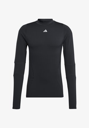 Black long-sleeve athletic shirt, made of smooth, stretchy fabric. Features a crew neckline and a small white logo on the chest.