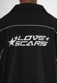 Love Scars COACH TRACK UNISEX - Treniņjaka - midnight purple