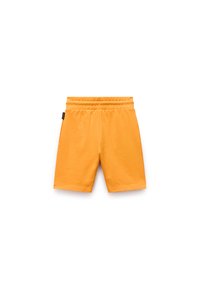 Oranga bomullsshorts med en elastisk midja. Har en slät yta och knälång klippning, lämplig för avslappnad användning.